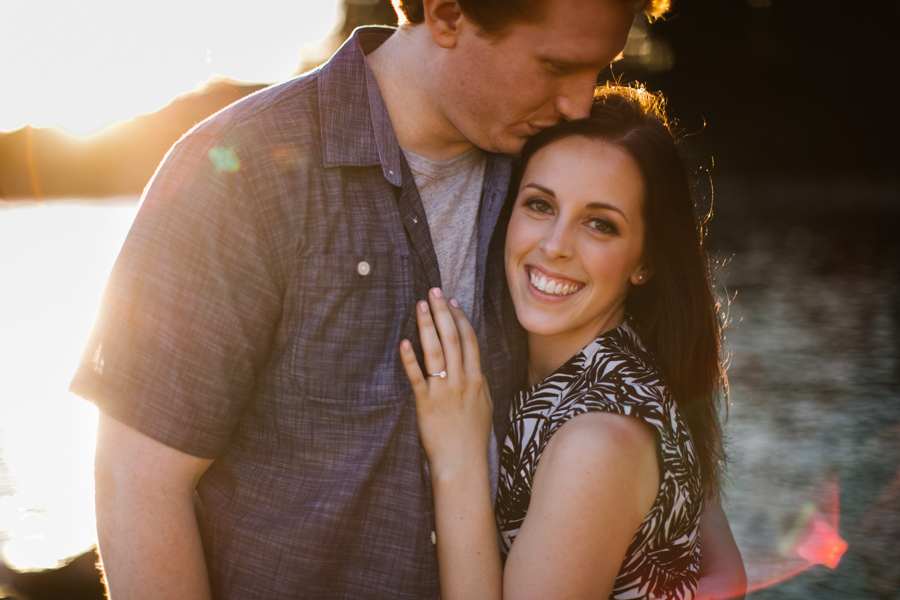 whytecliff park engagement session couple hugging kissing forehead