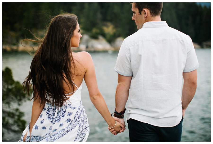 engagement couple holding hands